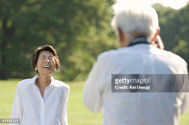 a senior couple in a park - only japanese stock pictures, royalty-free photos & images