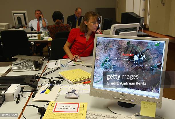 Employees of the German Foreign ministry are seen during a conference in the crisis reaction centre for German hostages at the Foreign Ministry on...