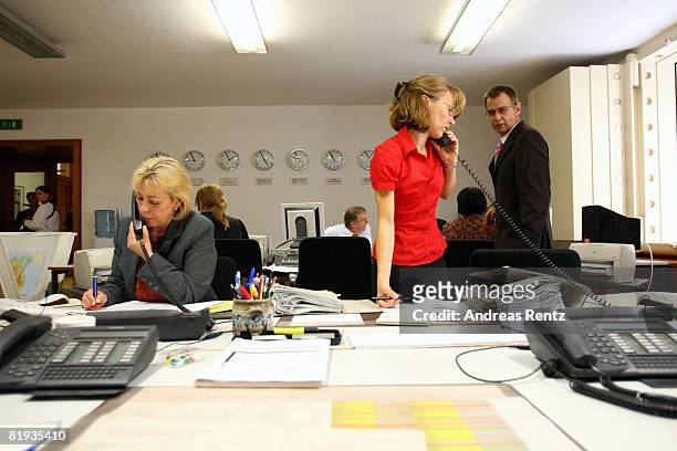 Employees of the German Foreign ministry are seen during a conference in the crisis reaction centre for German hostages at the Foreign Ministry on...