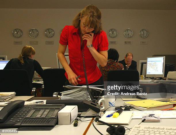 Employees of the German Foreign ministry are seen during a conference in the crisis reaction centre for German hostages at the Foreign Ministry on...