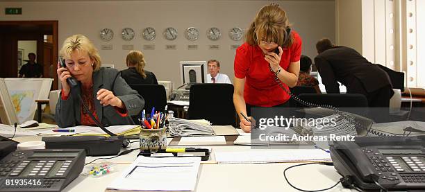 Employees of the German Foreign ministry are seen during a conference in the crisis reaction centre for German hostages at the Foreign Ministry on...