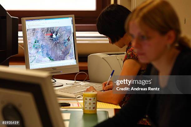 Employees of the German Foreign ministry are seen during a conference in the crisis reaction centre for German hostages at the Foreign Ministry on...