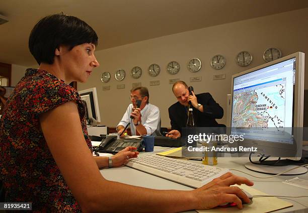 Employees of the German Foreign ministry are seen during a conference in the crisis reaction centre for German hostages at the Foreign Ministry on...