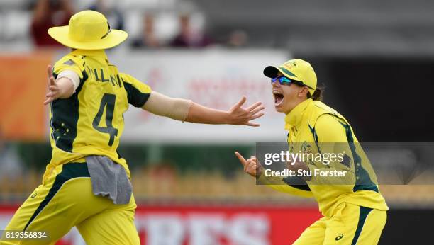 Australia fielder Nicole Bolton celebrates with Elyse Villani after Villani had caught India batsman Smitri Mandhana during the ICC Women's World Cup...