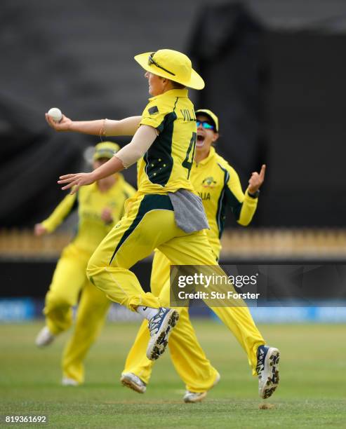 Australia fielder Nicole Bolton celebrates with Elyse Villani after Villani had caught India batsman Smitri Mandhana during the ICC Women's World Cup...