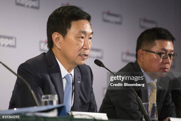 Loh Chin Hua, chief executive officer of Keppel Corp., left, speaks as Ang Wee Gee, chief executive office of Keppel Land Ltd., listens during a news...