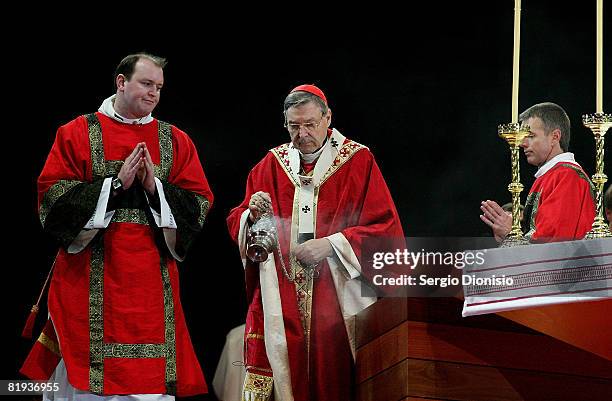 Archbishop of Sydney Cardinal George Pell AC holds Mass on stage at the Opening Mass formally celebrating the start of World Youth Day 2008 at...