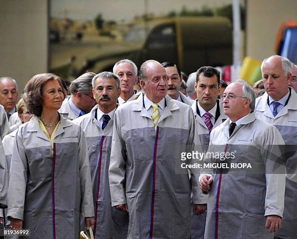 Spain's King Juan Carlos and Queen Sofia visit the PSA Peugeot Citroen's plant in Vigo during celebrations for the 50th anniversary of the plant with...