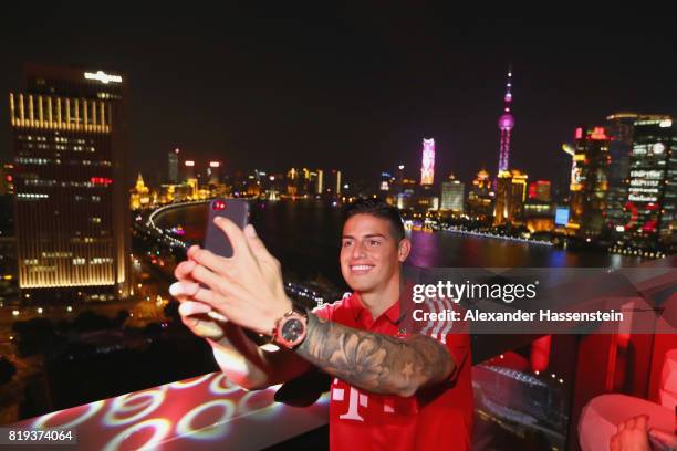 James Rodriguez of FC Bayern Muenchen takes a selfie with the Shanghai Bund during the Audi Night 2017 at Wanda Reign Hotel Shanghai during the Audi...