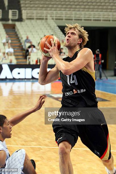 Dirk Nowitzki of Germany shoots against Jeff Xavier of Cape Verde during the Fiba Olympic Qualifier match between Cape Verde and Germany at the Oaka...