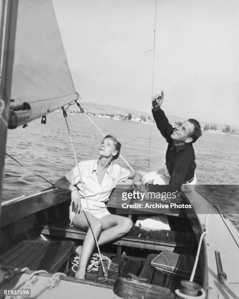 Actors Lauren Bacall and Humphrey Bogart enjoy a day's sailing, circa 1945.