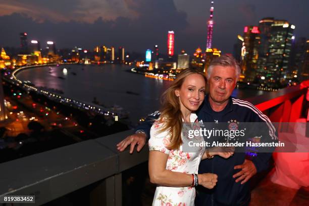 Carlo Ancelotti, head coach of FC Bayern Muenchen poses with his wife Mariann Barena McClay for a picture with the Shanghai Bund in the background...