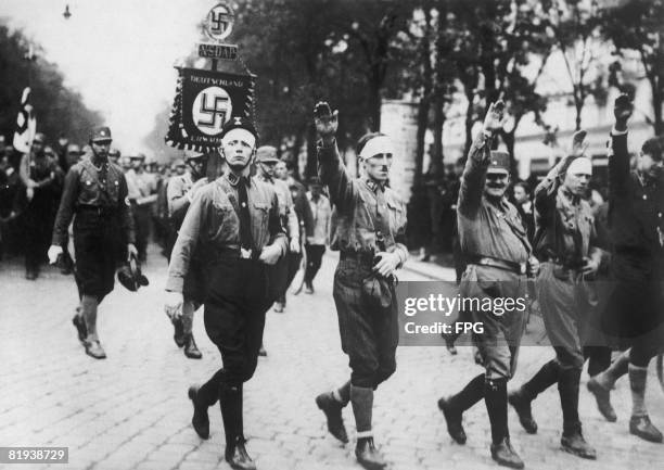 Veterans join in the Nazi Party parade at the Karntens or Carinthian Liberty Festival in Vienna, circa 1930. The festival is celebrating the freedom...