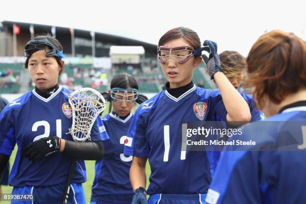 Mami Gondo of Japan adjusts her eye protector ahead of the classification match between Japan and Italy during the 2017 FIL Rathbones Women's...