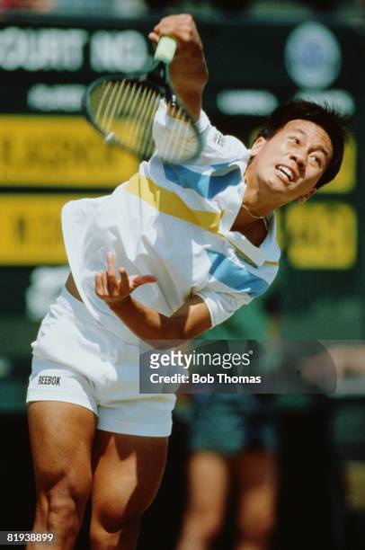 American tennis player Michael Chang pictured in action competing to reach the fourth round of the Men's Singles tournament at the Wimbledon Lawn...