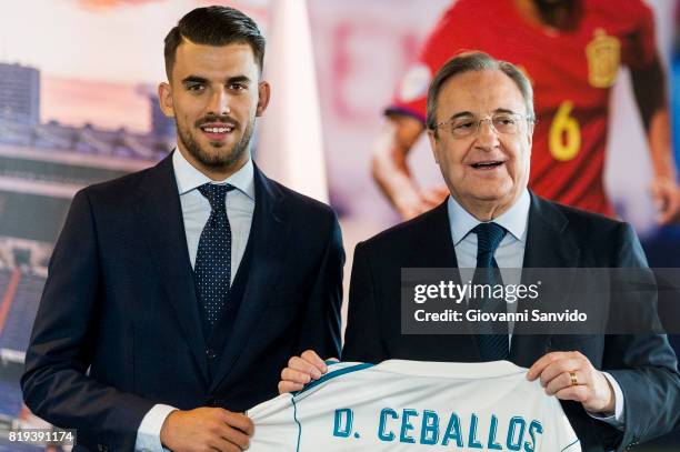New signing Spanish midfielder Dani Ceballos of Real Madrid poses with Florentino Perez, President of Real Madrid at the Santiago Bernabeu stadium at...
