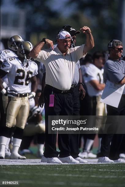 Defensive coordinator Steve Sidwell of the New Orleans Saints signals a defensive scheme on the sideline against the Seattle Seahawks at Husky...