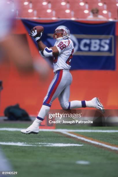 Wide receiver Terry Glenn of the New England Patriots catches a pass prior to playing against the Cleveland Browns at Cleveland Browns Stadium in...