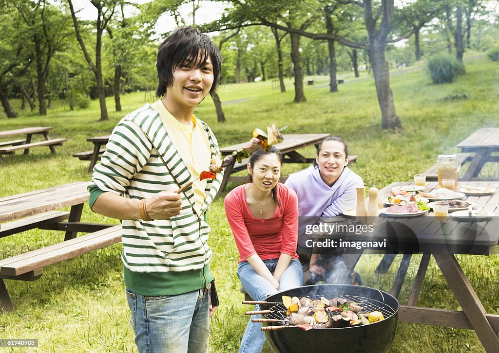 Young people barbecuing