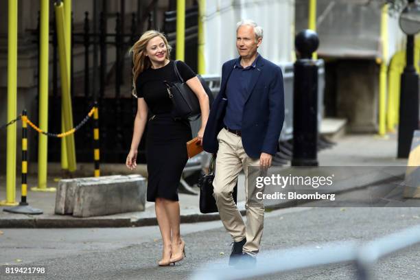 Kathryn Parsons, co-founder of Decoded, left, and Luke Johnson, co-founder of Risk Capital Partners LLP, arrive in Downing Street for a business...