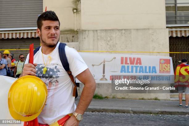 Workers of ILVA steelworks protest at the Ministry of Economic Development against the sale of steel producer Ilva to ArcelorMittal, on July 20, 2017...