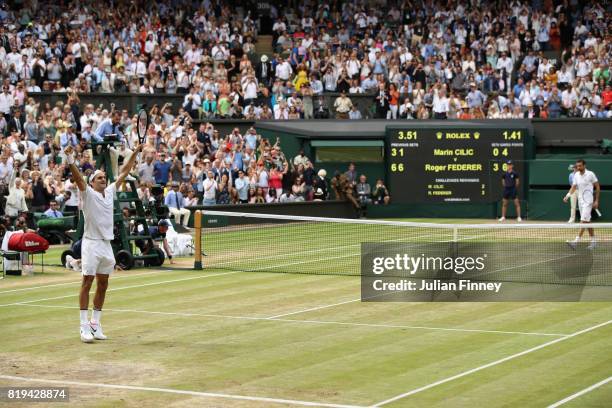 Roger Federer of Switzerland celebrates victory after the Gentlemen's Singles final against Marin Cilic of Croatia on day thirteen of the Wimbledon...