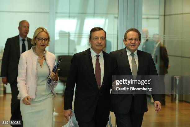 Mario Draghi, president of the European Central Bank , center, Vitor Constancio, vice president of the European Central Bank, right, and Christine...