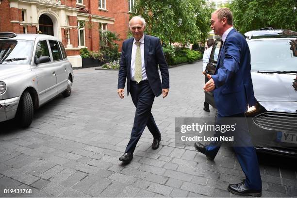 New Liberal Democrats leader Vince Cable passes former leader Tim Farron as he arrives at the St Ermin's Hotel on July 20, 2017 in London, England....