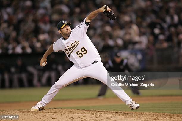 Andrew Brown of the Oakland Athletics pitches during the game against the New York Yankees at McAfee Coliseum in Oakland, California on June 12,...