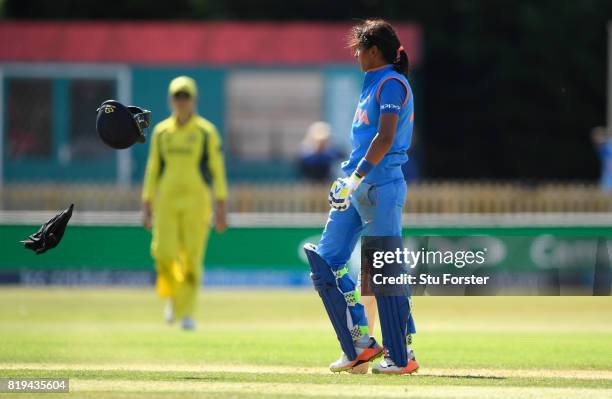 India batsman Harmanpreet Kaur reacts by throwing her helmet off onto the ground after reaching her century during the ICC Women's World Cup 2017...