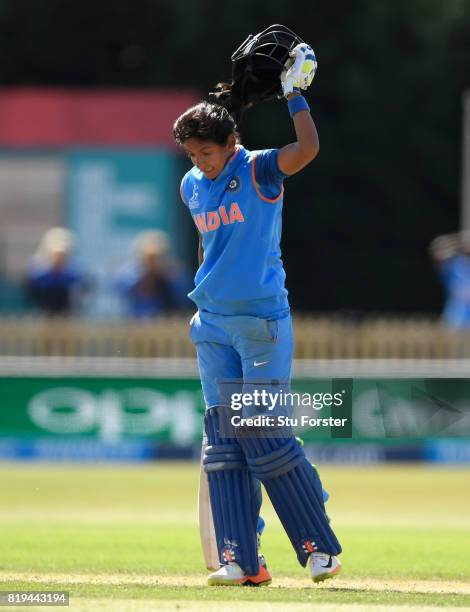 India batsman Harmanpreet Kaur reacts by throwing her helmet off onto the ground after reaching her century during the ICC Women's World Cup 2017...