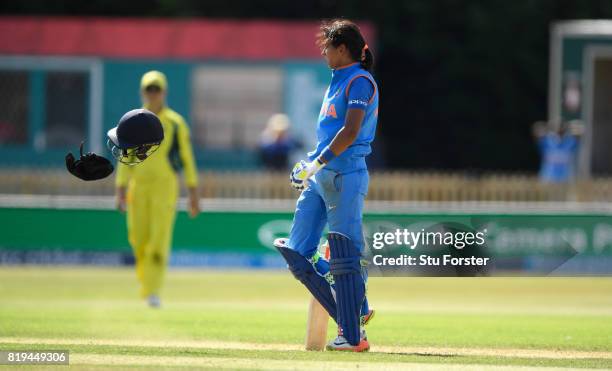 India batsman Harmanpreet Kaur reacts by throwing her helmet off onto the ground after reaching her century during the ICC Women's World Cup 2017...