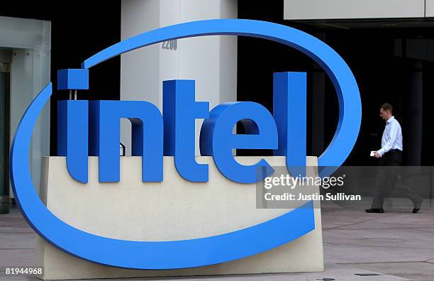 An Intel employee walks by a sign at the Intel company headquarters July 15, 2008 in Santa Clara, California. Intel has reported a 25 percent...