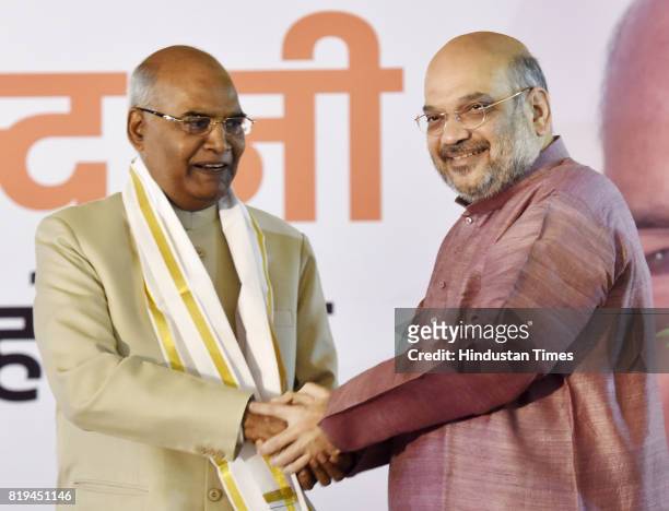 National President Amit Shah greets newly elected President of India Ram Nath Kovind after his win in Presidential election at 10 Akbar Road on July...