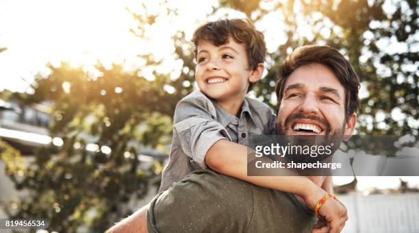 it takes a special person to be a dad - piggyback stock pictures, royalty-free photos & images