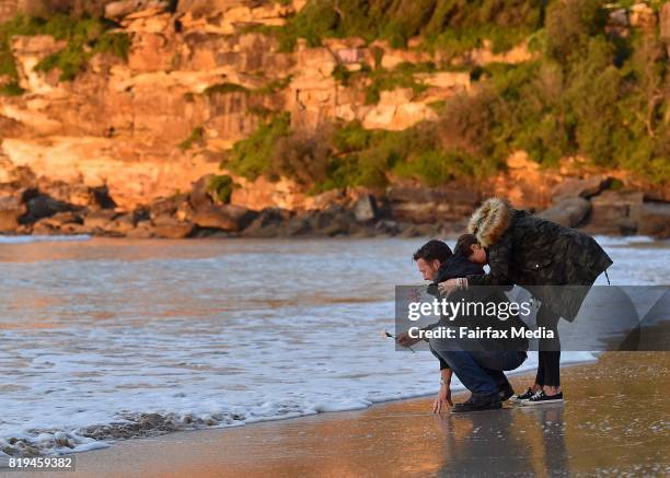 Jason Ruszczyk, the brother of Justine Damond and his wife Katarina Ruszczyk are seen during a vigil for his sister at Freshwater Beach on July 19,...