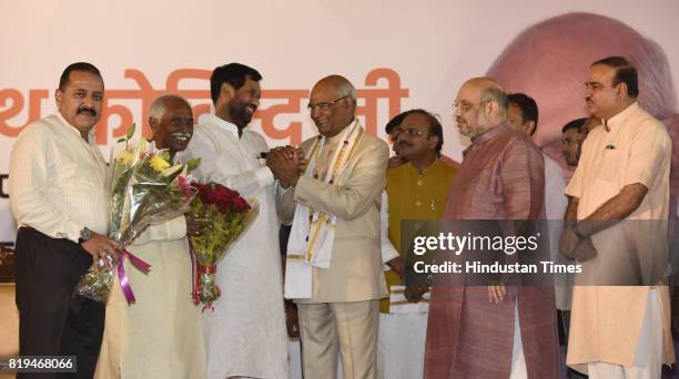 National President Amit Shah with other union ministers greets newly elected President of India Ram Nath Kovind after his win in Presidential...