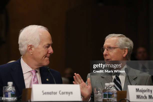 Senate Majority Leader Mitch McConnell and Sen. John Cornyn attend a Foreign Relations Committee comfirmation hearing for ambassadorships, on Capitol...