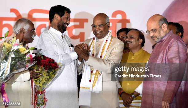 National President Amit Shah with other union ministers greets newly elected President of India Ram Nath Kovind after his win in Presidential...