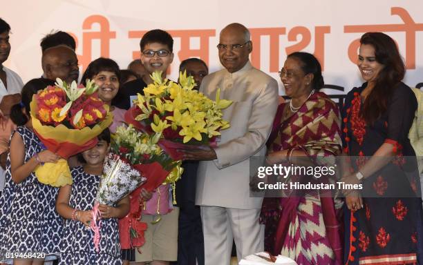 Wife Savita Kovind, family members and grand children offering sweets to Ram Nath Kovind after his win in Presidential election at 10 Akbar Road on...