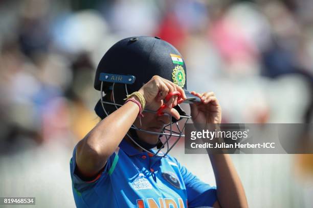 Sushma Verma of India works on her helmet during The Womens World Cup 2017 Semi-Final between Australia and India at The County Ground on July 20,...