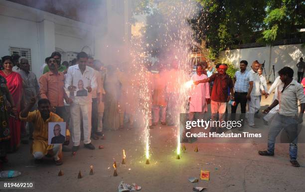 Workers celebrate at party office after NDA candidate Ram Nath Kovind was elected as 14th President of India on July 20, 2017 in Lucknow, India. NDA...