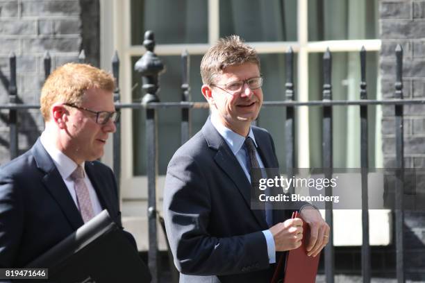 Greg Clark, U.K. Business secretary, right, and Stephen Martin, director general of the Institute of Directors, depart Downing Street following a...