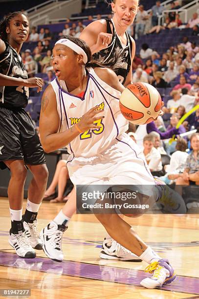 Cappie Pondexter of the Phoenix Mercury drives against the San Antonio Silver Stars on July 15 at U.S. Airways Center in Phoenix, Arizona. NOTE TO...