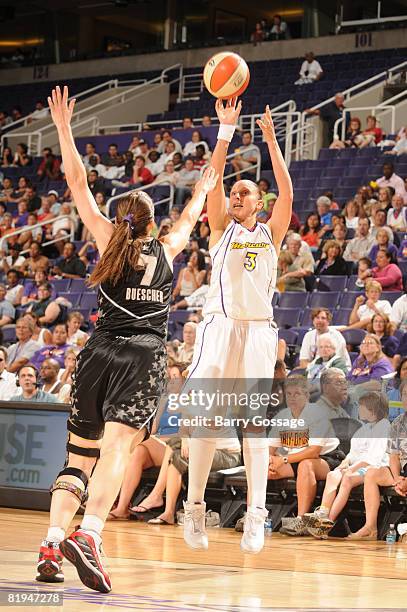 Diana Taurasi of the Phoenix Mercury shoots over Erin Buescher of the San Antonio Silver Stars on July 15 at U.S. Airways Center in Phoenix, Arizona....