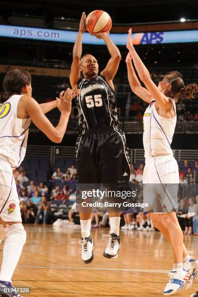 Vickie Johnson of the San Antonio Silver Stars shoots against Kelly Miller of the Phoenix Mercury on July 15 at U.S. Airways Center in Phoenix,...