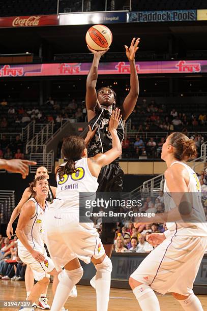 Sophia Young of the San Antonio Silver Stars shoots against Tangela Smith of the Phoenix Mercury on July 15 at U.S. Airways Center in Phoenix,...