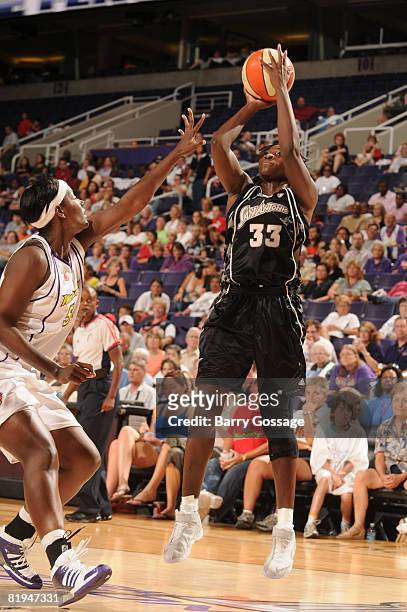 Sophia Young of the San Antonio Silver Stars shoots against Barbara Farris of the Phoenix Mercury on July 15 at U.S. Airways Center in Phoenix,...