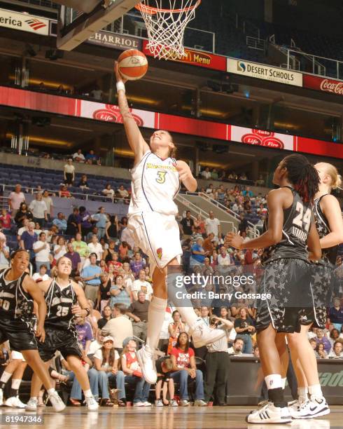 Diana Taurasi of the Phoenix Mercury shoots against Morernike Atunrase of the San Antonio Silver Stars on July 15 at U.S. Airways Center in Phoenix,...