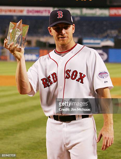 American League All-Star J.D. Drew of the Boston Red Sox holds his MVP trophy after the 79th MLB All-Star Game at Yankee Stadium on July 15, 2008 in...